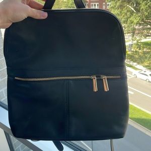 Target backpack. Laptops dont fit but ipads do.